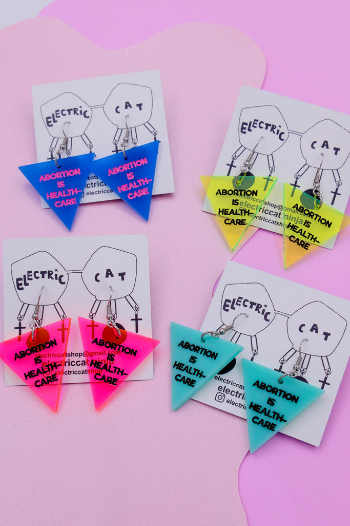 Abortion is healthcare acrylic earrings by electric cat.