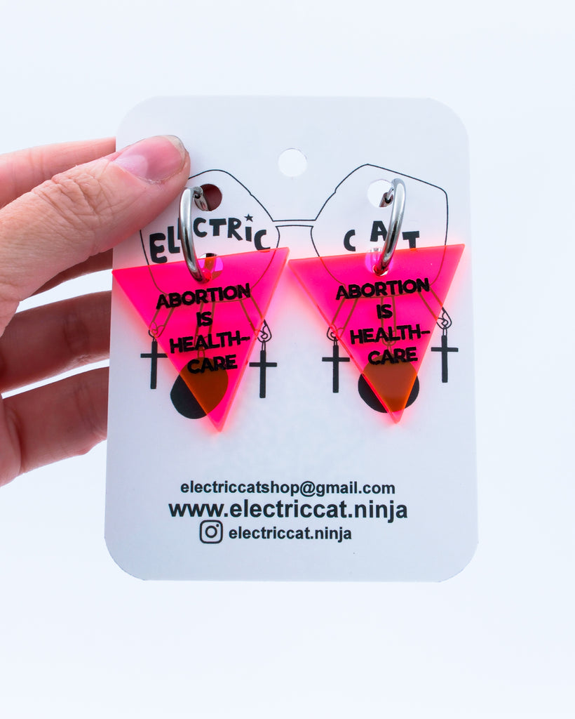 Neon Pink abortion is healthcare earrings by Electric Cat