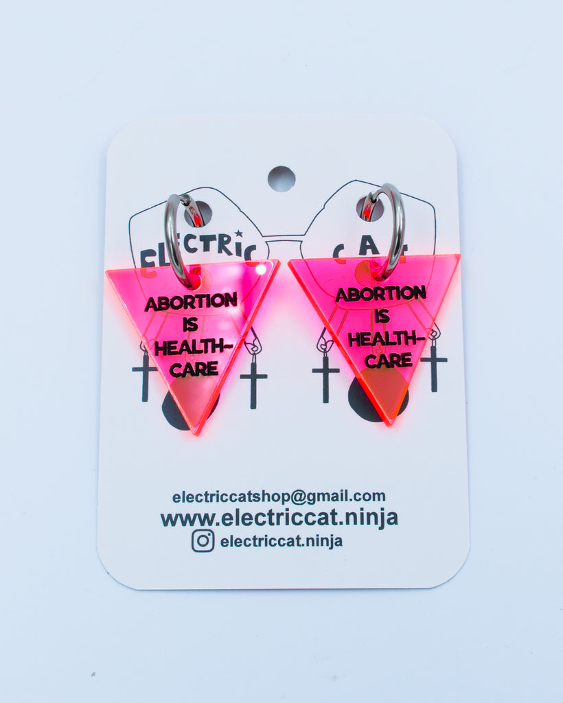Neon Pink abortion is healthcare earrings by Electric Cat
