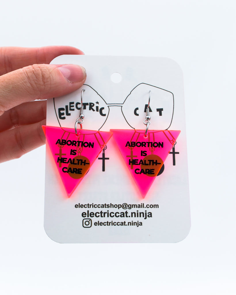 Neon Pink abortion is healthcare earrings by Electric Cat