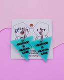 Abortion is healthcare acrylic earrings by electric cat.
