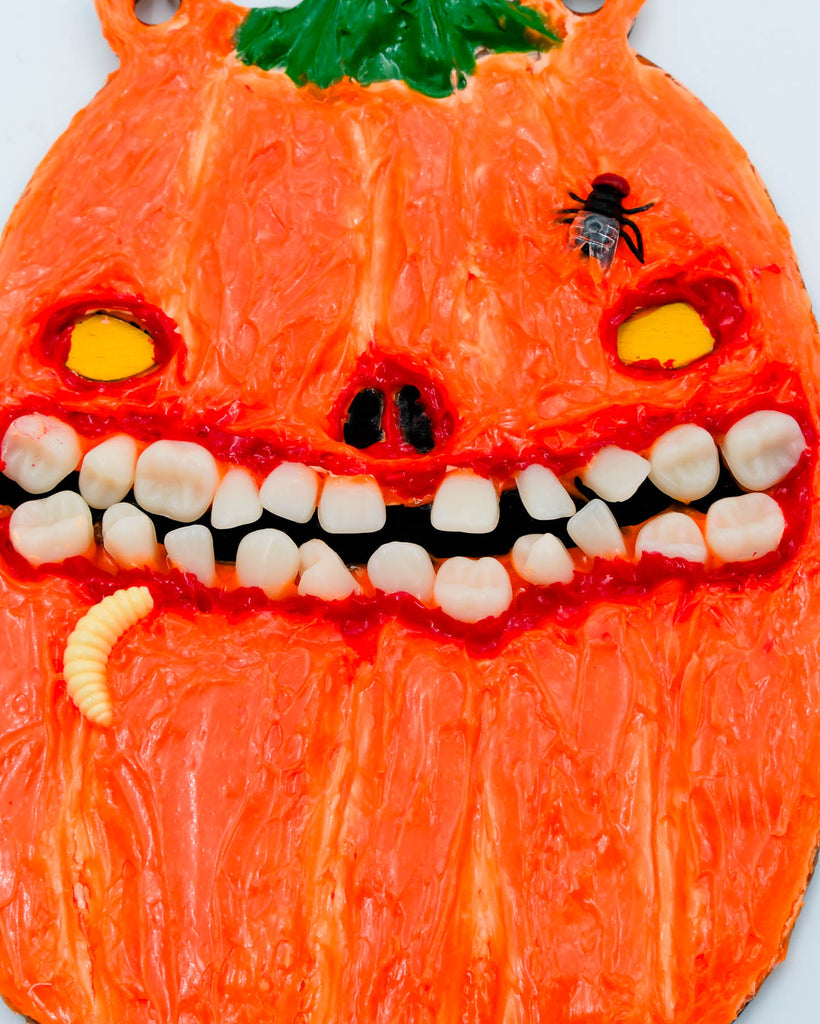 Handmade creepy pumpkin face with resin teeth, acrylic texture, and tiny maggot accent, wall art by Electric Cat.