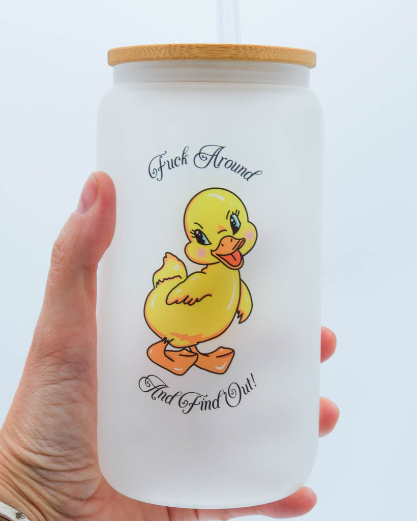16 oz frosted glass cup with bamboo lid and glass straw featuring a vintage-style yellow duck illustration and the phrase “Fuck Around and Find Out,” sublimated by Electric Cat.