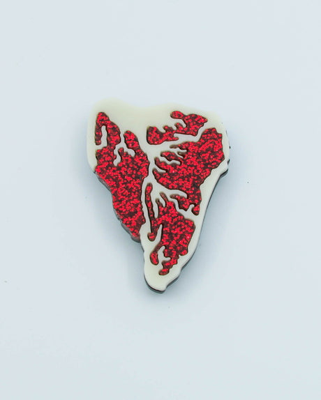 Handmade acrylic steak magnet featuring red glitter details and ivory base, crafted by Electric Cat.