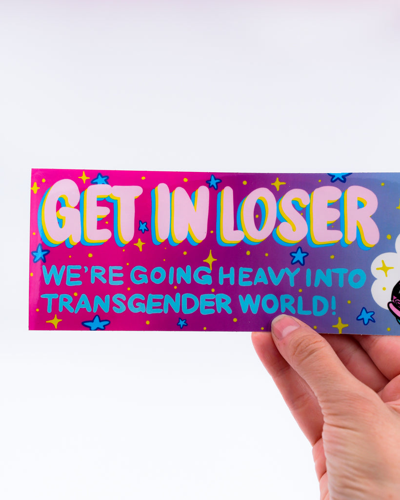 Magic school bus bumper sticker with the saying "get in loser, we're going heavy into transgender world!" by electric cat