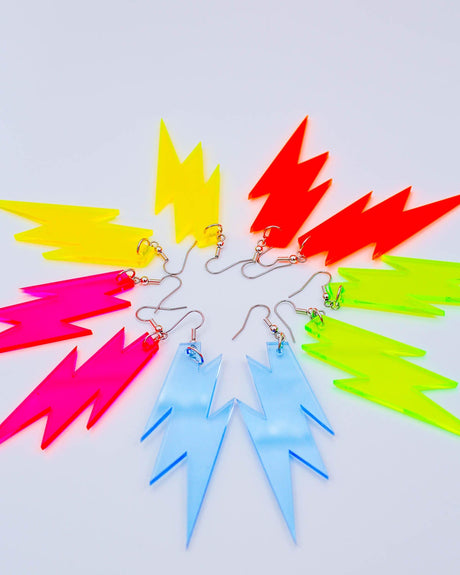 A set of neon lightning bolt earrings in various colors including yellow, pink, and blue.