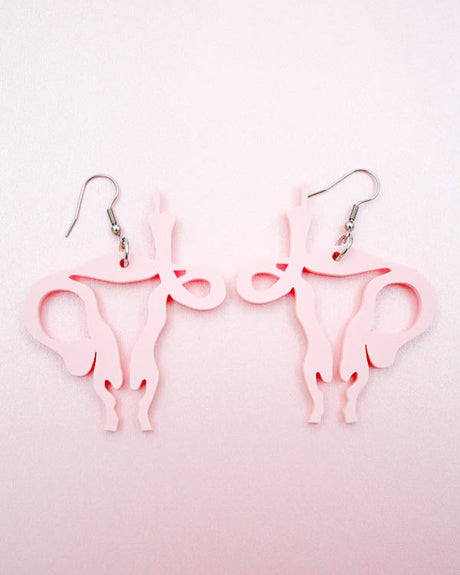 uterus middle finger earrings by electric cat