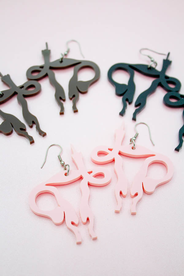 uterus middle finger earrings by electric cat