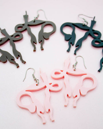 uterus middle finger earrings by electric cat